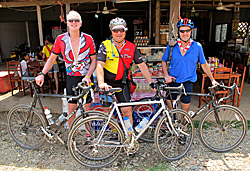 Three bikers in Van Vieng, Laos