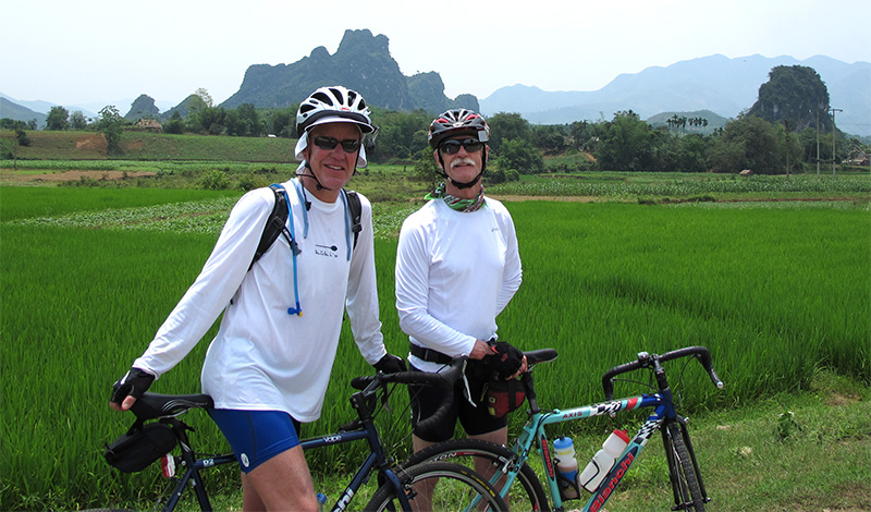 Laos Bicycle Tour riders in Vieng Xai