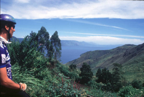 Cyclist overlooking Lake Toba